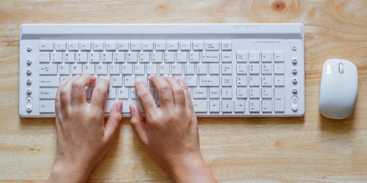 A hand on a computer keyboard for illustration. PHOTO/ Digital Unite.