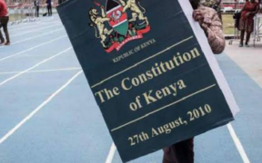 Kenyan holding the Constitution 2010. PHOTO/Courtesy.
