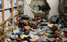 A picture of a drilled wall that the perpetrators used in breaching the bank Image/CNN