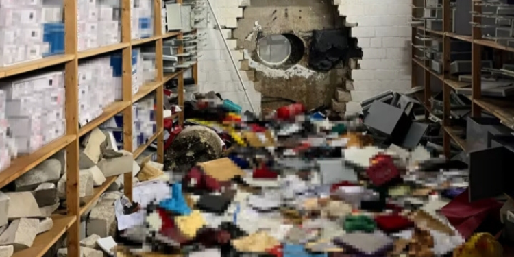 A picture of a drilled wall that the perpetrators used in breaching the bank Image/CNN