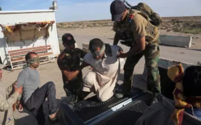 Iraqi security forces detained men suspected of being members of the Islamic State for interrogation last month. The men were found among civilians returning to Ramadi.Credit...Khalid Mohammed/Associated Press