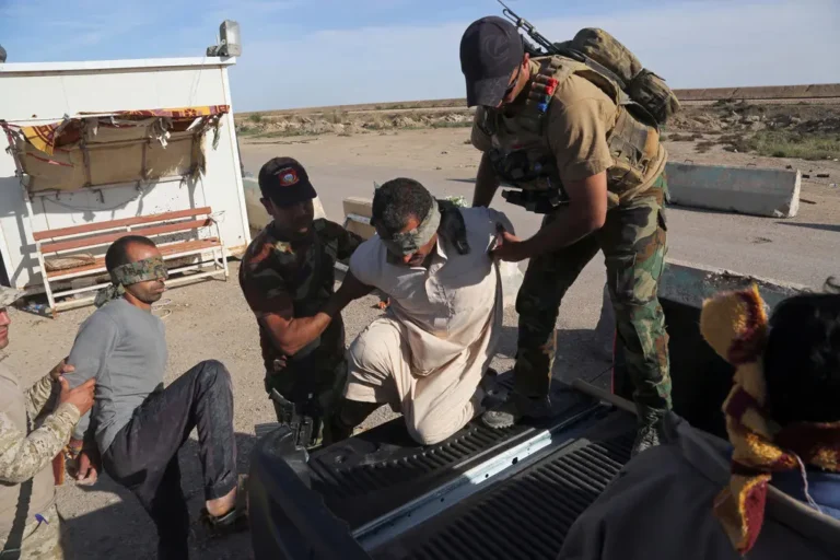 Iraqi security forces detained men suspected of being members of the Islamic State for interrogation last month. The men were found among civilians returning to Ramadi.Credit...Khalid Mohammed/Associated Press