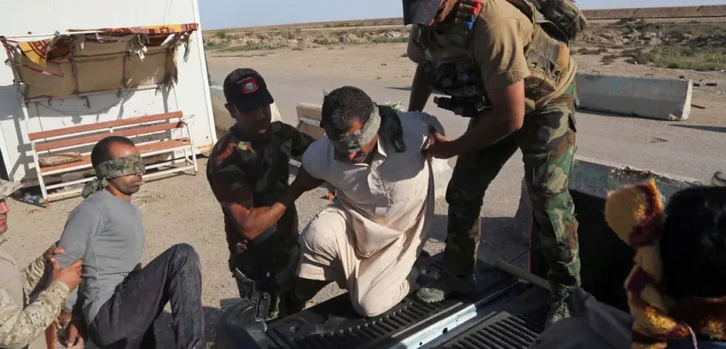 Iraqi security forces detained men suspected of being members of the Islamic State for interrogation last month. The men were found among civilians returning to Ramadi.Credit...Khalid Mohammed/Associated Press