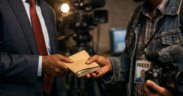 AI Generated Image of A Politician Handing Over An Envelope To A Media Personnel. PHOTO/ Courtesy