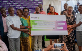 Dr. Mumbua Mbaluka, Head of Institutional Advancement at National Intelligence and Research University (NIRU) Hands Over a Scholarship Certificate To One Of The Beneficiaries Of The 2026 Enwealth Fanisi Scholarship. PHOTO/FILE