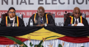The Ugandan Electoral Commission Chairman, Justice Byabakama Mugenyi Simon (C) among with other Electoral Commission