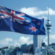 New Zealand Flag With A Background of The City's Buildings. PHOTO/ File