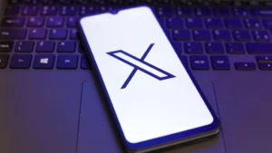 An opening on the X app on phone. Paris prosecutors raid France offices of Elon Musk's X. PHOTO/Getty Images