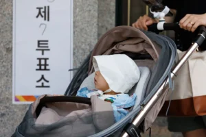 A baby Carried on a Baby Stroller. PHOTO/ BBC 