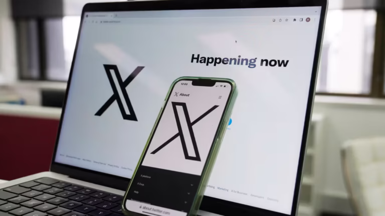 The opening page of X is displayed on a computer and phone, Oct. 16, 2023, in Sydney. (AP Photo/Rick Rycroft, File)