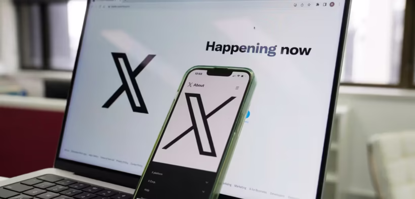 The opening page of X is displayed on a computer and phone, Oct. 16, 2023, in Sydney. (AP Photo/Rick Rycroft, File)