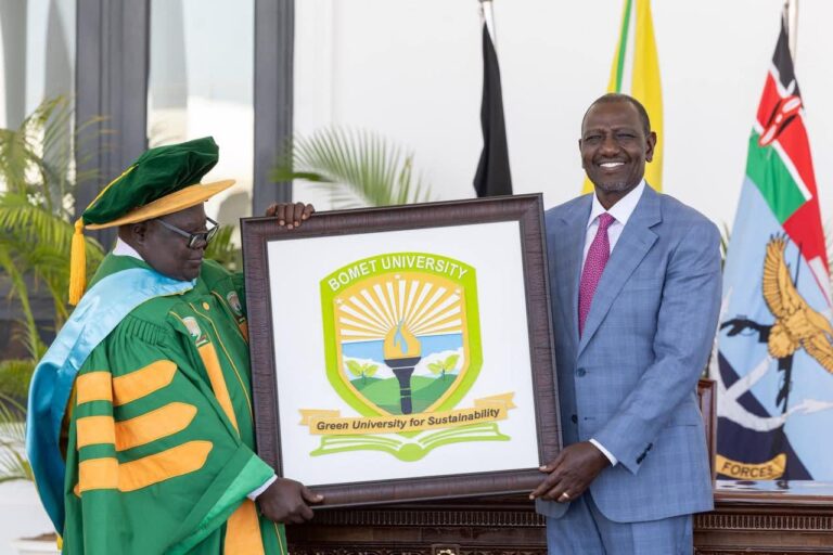 Bomet University Chancellor receiving the schoool logo from the president during the a ward of charter ceremony on February 3, 2025 at the State House. PHOTO/@EduMinKenya/X