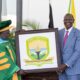 Bomet University Chancellor receiving the schoool logo from the president during the a ward of charter ceremony on February 3, 2025 at the State House. PHOTO/@EduMinKenya/X