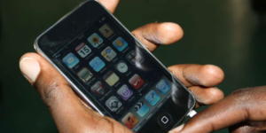 A user browses through the menu of a smartphone.