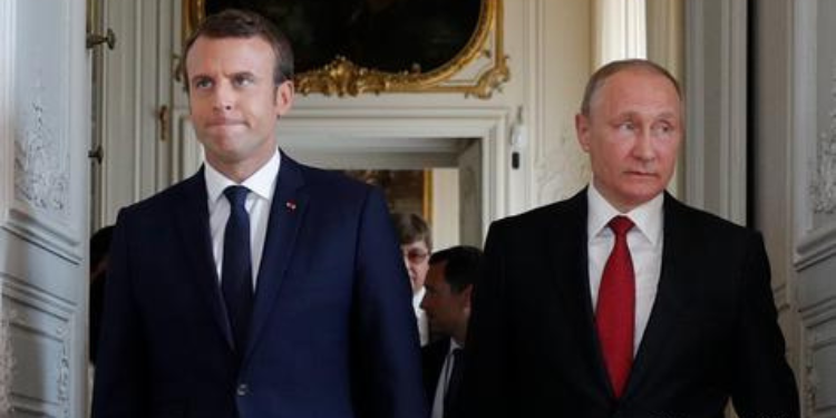 A Photo of France Prime Minister Emmanuel Macron and Russian President Vladimir Putin In A Past Event. PHOTO/ File
