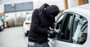 Balaclaved Individual Attempting A Forced Entry To A Parked Vehicle in Unnamed Location. PHOTO/ File