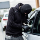 Balaclaved Individual Attempting A Forced Entry To A Parked Vehicle in Unnamed Location. PHOTO/ File