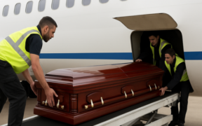 AI image of airport workers loading a casket into the cargo area of a plane. PHOTO/ File