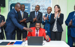 From left: Frank Mwiti Chief Executive Officer, Nairobi Securities Exchange;David Wainaina,Head of Trading,Data and Analytics, Nairobi Securities Exchange;Kiprono Kittony, Chairman, Nairobi Securities Exchange;H.E.Diana Dalton, Deputy High Commissioner to Kenya, British High Commission Kenya ;Ugas Sheikh -Mohamed , Chairman, Capital Markets Authority;Peter Irungu,Trader, Dyer&Blair Investment LTD(Seated);Raghar Gandhi,CEO Africa Logistics Properties;Stephen Odua, Director of Industries,State of Department for Investment Promotion, Ministry of Investment,Trade & Industry during the live trade of ALP REIT units on the main segment market of the Nairobi Securities Exchange in Nairobi PHOTO/ALP