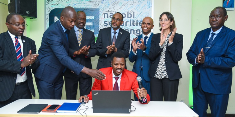 From left: Frank Mwiti Chief Executive Officer, Nairobi Securities Exchange;David Wainaina,Head of Trading,Data and Analytics, Nairobi Securities Exchange;Kiprono Kittony, Chairman, Nairobi Securities Exchange;H.E.Diana Dalton, Deputy High Commissioner to Kenya, British High Commission Kenya ;Ugas Sheikh -Mohamed , Chairman, Capital Markets Authority;Peter Irungu,Trader, Dyer&Blair Investment LTD(Seated);Raghar Gandhi,CEO Africa Logistics Properties;Stephen Odua, Director of Industries,State of Department for Investment Promotion, Ministry of Investment,Trade & Industry during the live trade of ALP REIT units on the main segment market of the Nairobi Securities Exchange in Nairobi PHOTO/ALP