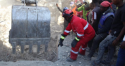 With Guidance from Kenya Red Cross Personnel a bulldozer is guided to dig out rubbles of the Shauri Moyo Building as Rescue Operations Continue. PHOTO/ KRC