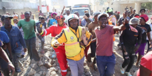 A resident of Shauri Moyo being evicted from the collapsed building rubble by Kenya Red Cross staffs and other residents. PHOTO/ KRC