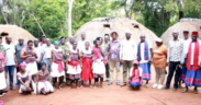 Runyenjes MP Muchangi Karemba posing for a photo with the members of Kaya Kauma community in Kilifi County. PHOTO/ PCS