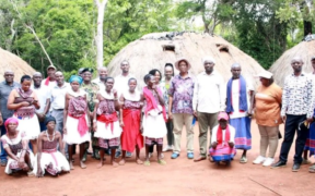 Runyenjes MP Muchangi Karemba posing for a photo with the members of Kaya Kauma community in Kilifi County. PHOTO/ PCS
