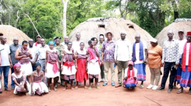 Runyenjes MP Muchangi Karemba posing for a photo with the members of Kaya Kauma community in Kilifi County. PHOTO/ PCS