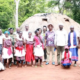Runyenjes MP Muchangi Karemba posing for a photo with the members of Kaya Kauma community in Kilifi County. PHOTO/ PCS
