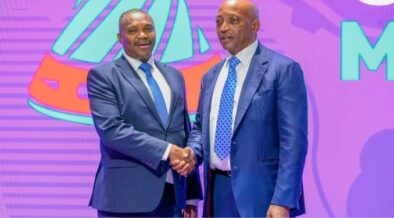 Sports principal secretary Elijah Mwangi with Caf president Patrice Motsepe