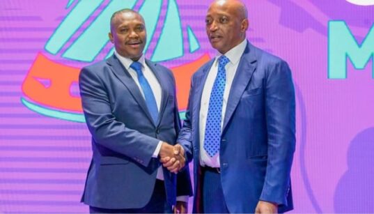 Sports principal secretary Elijah Mwangi with Caf president Patrice Motsepe
