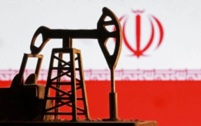 Model of an oil pump in front of the Iranian flag PHOTO/Reuters