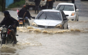 Motorists navigating a heavily flooded road PHOTO/File