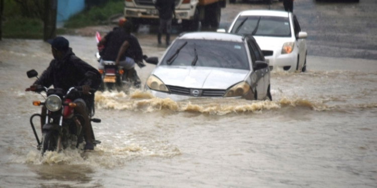 Motorists navigating a heavily flooded road PHOTO/File