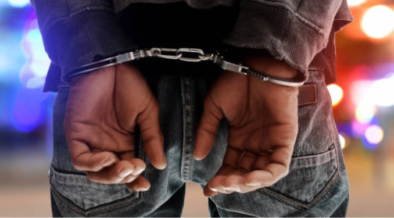 A photo of a man in police handcuffs. PHOTO/ istock images