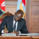 President Ruto signing the bill into law