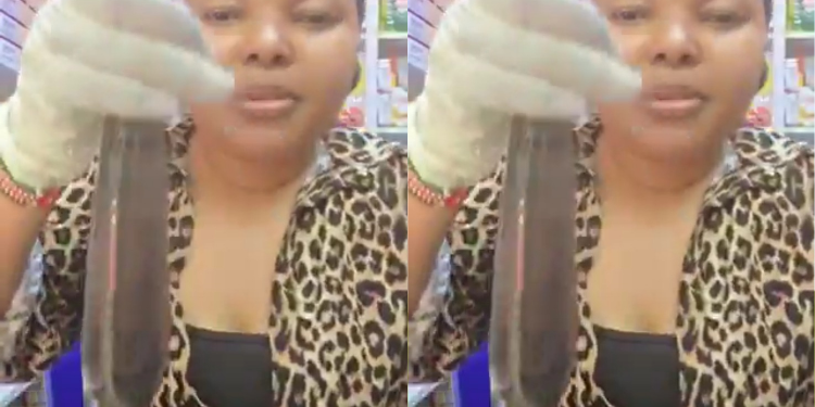 A kenyan lady from Glamaris Pharmaceutical displays the smart condom that is able to detect infection and viruses and changes colour. PHOTO/ File