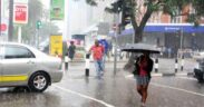 A picture of people caught in rainfall in Nairobi