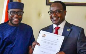 CS Education Julius Ogamba awarding a certificate to African Talent University