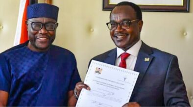 CS Education Julius Ogamba awarding a certificate to African Talent University