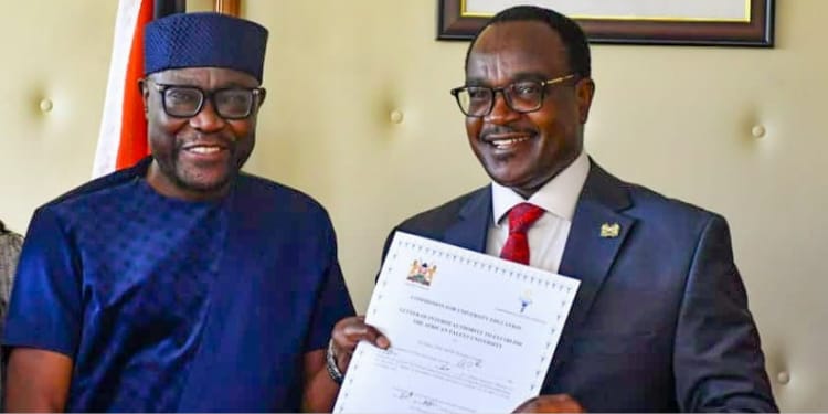 CS Education Julius Ogamba awarding a certificate to African Talent University