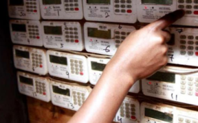 a person feeding in units at a token meter