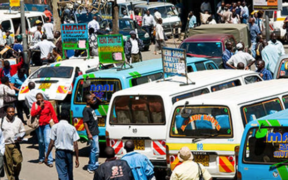 Matatu and passengers at a bus stage in Nairobi. PHOTO/ YORK.