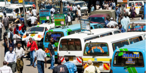 Matatu and passengers at a bus stage in Nairobi. PHOTO/ YORK.