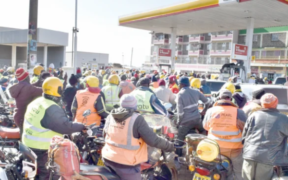 Motorists and motorcyclists scramble for fuel at a Shell petrol station in Nyahururu town. PD/David Macharia EPRA