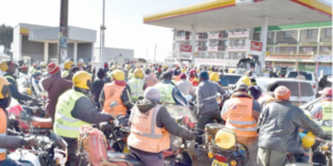 Motorists and motorcyclists scramble for fuel at a Shell petrol station in Nyahururu town. PD/David Macharia EPRA
