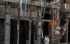 UN humanitarian coordinator Denise Brown highlights the worsening crisis in Sudan as a damaged residential building stands in Khartoum during ongoing fighting on April 16, 2026.