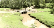 Collapsed Sigowet River Bridge in Narok West after heavy rains washed it away, cutting off the Ngiito–Olereut route and disrupting transport, livelihoods, and school access.