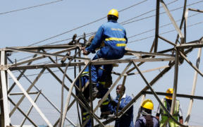 Kenya power workers working on a power line PHOTO/Standard